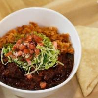 Carne Adovada · Pecan smoked red chile pork, rice, beans, shredded lettuce, pico & a tortilla.