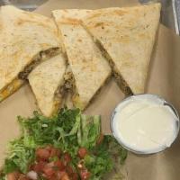 Green Chili Pork Quesadilla · Slow roasted, green chili pulled pork, cheddar and mozzarella cheese blend melted in a toast...