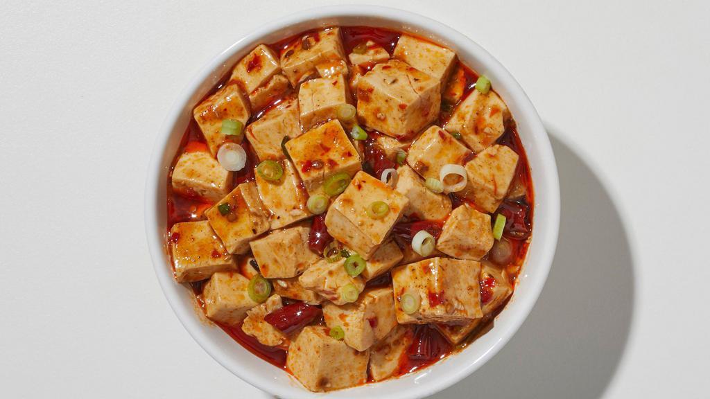 Mapo Tofu · Tofu, peas, carrots, onions, straw mushroom in a spicy dried chili pepper, chili paste in our chef’s chili seared spicy sauce.