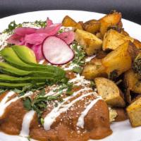 Enfrijoladas · Three mexican scramble egg tacos in a hand made tortilla smothered in a pinto bean sauce. Si...