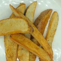 Potato Wedges · Seasoned fried potato wedges with sides of bbq and ranch.