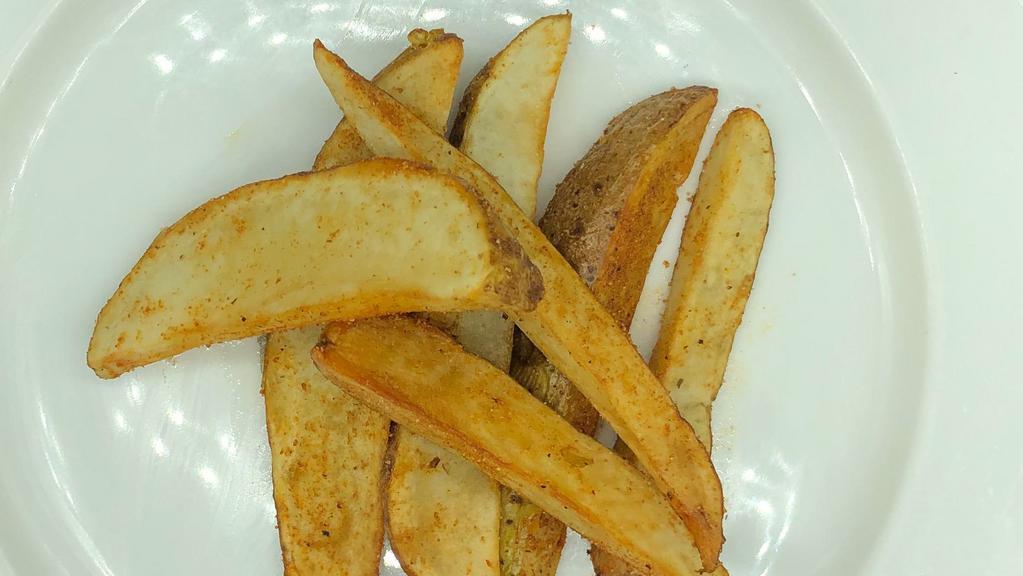 Potato Wedges · Seasoned fried potato wedges with sides of bbq and ranch.
