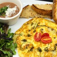 Torta Española  · Eggs, potatoes, bell peppers, zucchini and onion torta (like a round omelette) with beans, g...