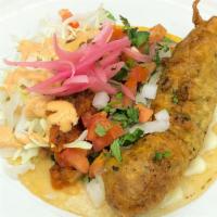 Fish Taco · Battered cod fillet, mayo, cabbage, pico de gallo, salsa, creamy chipotle sauce, and red pic...