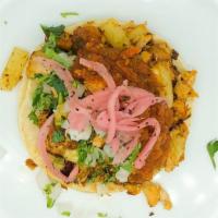 Al Pastor Taco · Achiote marinated Pork, onion, cilantro, salsa and red pickled onion.