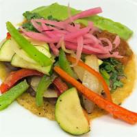 Veggie Taco · Grilled veggies, beans, cilantro, salsa, guac, and red pickled onion. In our hand made corn ...