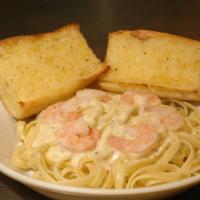 Family Fettuccini Alfredo · Served with garlic bread and salad.