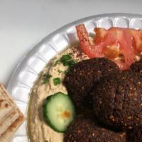 Falafel · Ground garbanzo beans mixed with parsley, onion, garlic, and spices. Deep fried and served o...
