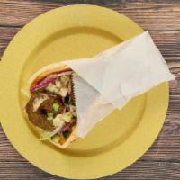 Falafel Pita -  Build Your Own · A vegetarian, dish blend of garbanzo beans, vegetables and seasonings, deep fried and served...