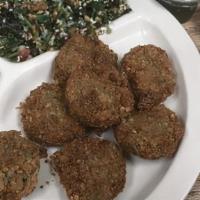Falafels · Crispy delicious lightly fried chickpeas with pita kitchen seasoning!