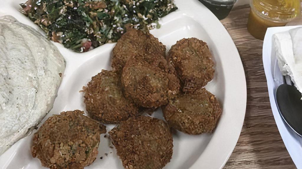 Falafels · Crispy delicious lightly fried chickpeas with pita kitchen seasoning!