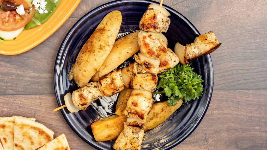 Chicken Souvlaki (Kabob) · Marinated chicken on a skewer with onions in between cooked perfectly ( 2 skewers), served with small salad, choice of Fries or Greek baked potatoes, side of pita and a choice of tzaziki or hummus