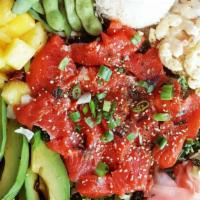 Wild Caught Salmon Poke · Comes with a serving of one scoop of rice, one scoop of macaroni salad and dressing. Salmon ...