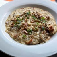 Risotto  · Arborio super fine Italian rice served in a Tuscan sauce, asparagus, tomatoes and morels mus...