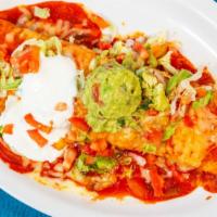 Burrito Tapatio · Filled with top sirloin guacamole rice and beans. topped with lettuce tomato and sour cream....