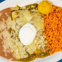 Enchilada Suiza · 2 corn tortillas stuffed with your choice of filling. topped with a delicious green tomatill...
