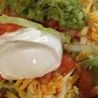 Taco Salad Cazuela · A bowl-shaped flour tortilla deep-fried and filled with shredded beef or chicken lettuce tom...
