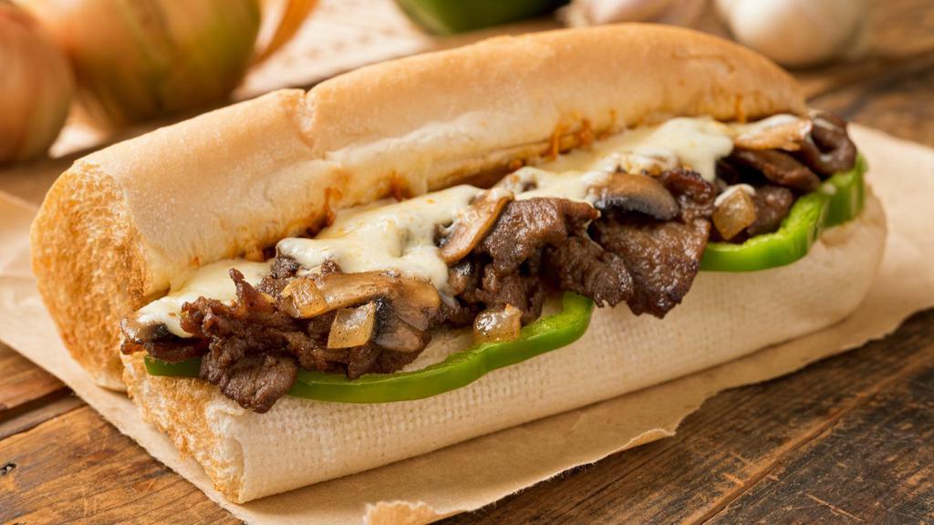 Cheese Steak Sandwich · Delicious cheese steak sandwich with mouth watering steak, American cheese, and grilled onions.