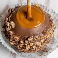 English Toffee Apple · Caramel-covered granny smith apple rolled in almonds and toffee pieces, drizzled with milk c...