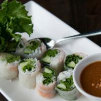 Shrimp Noodle Rolls · Green leaf, basil, pickled daikon, and carrots. Served with peanut sauce.
