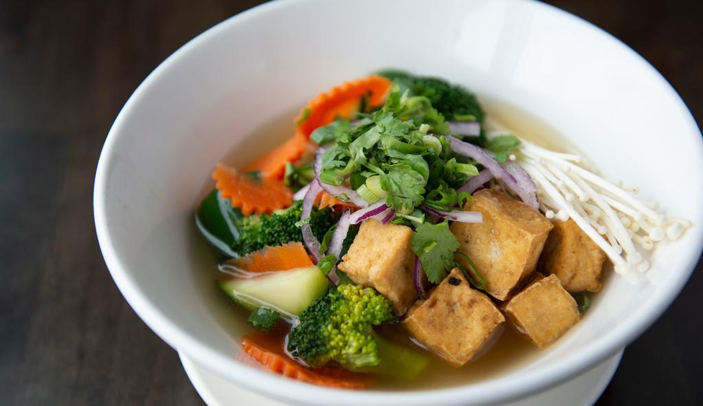 Vegetable And Tofu Pho · Fried tofu, carrots, broccoli, and zucchini in a vegetarian broth. Served with fresh bean sprouts, basil, lime, and jalapeños.