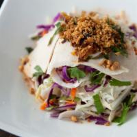 Chicken Fresh Cabbage Salad · Fresh white and red cabbage, pickled daikon, carrots, and ginger vinaigrette. Served with ro...