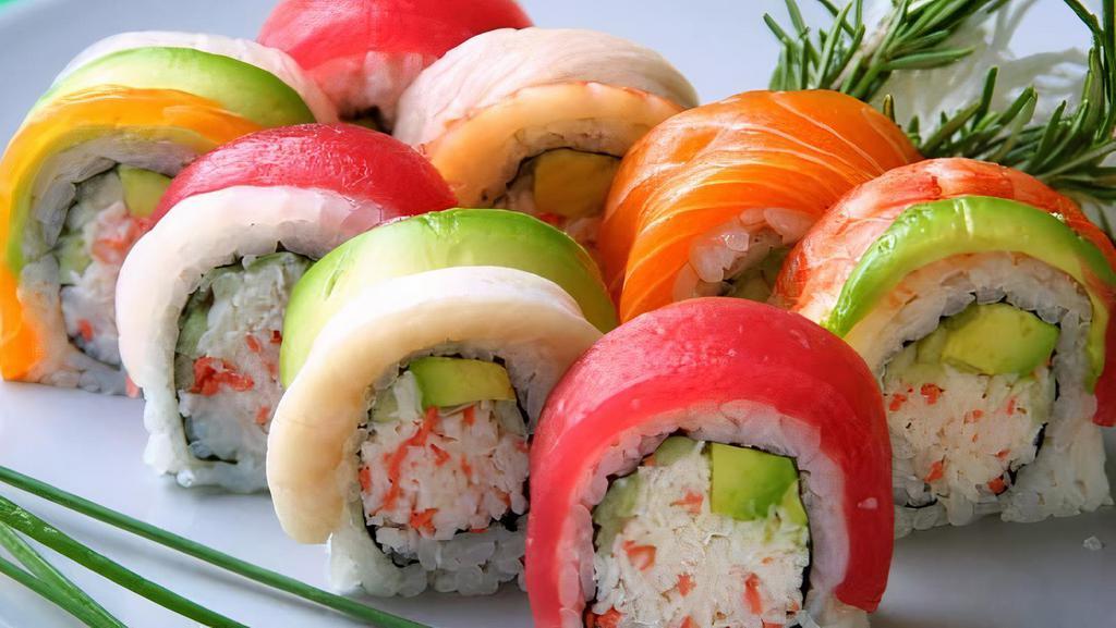 Rainbow Roll · Crab salad, cucumber, avocado, salmon and tuna on top.