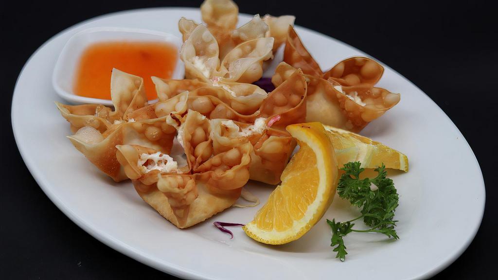 Crab Cheese Wontons (6 Pcs./Serving) · A mixture of imitation crab meat, cream cheese, and carrots, served with thin sweet and sour sauce.