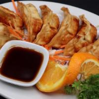 Pot Stickers (8 Pcs./Serving) · Deep-fried pot stickers stuffed with ground pork and vegetables, served with our homemade sp...