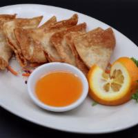 Fried Wontons (8 Pcs./Serving) · Deep-fried marinated ground pork wrapped in wonton paper, served with sweet and sour sauce.