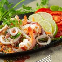 Combination Seafood Salad / Yum Talay · A mixture of a variety of seafood (shrimp, squid, mussels, scallops, and crab) cilantro, gre...