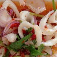Squid Salad / Yum Pla Muk · Squid, cilantro, green onions, red onions, tomatoes, carrots, and lettuce all tossed in a sp...