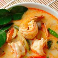 Tom Yum · Spicy and tangy lemongrass broth with mushrooms, onions, tomatoes, your choice of meat, cila...