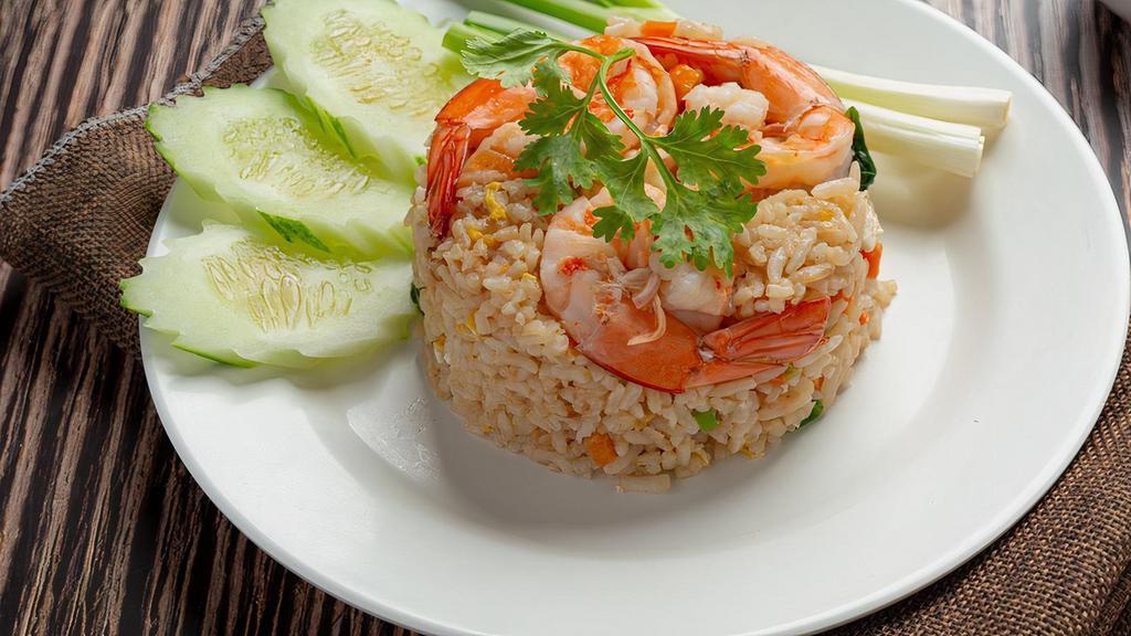 Fried Rice · Your choice of meat stir-fried with Thai jasmine rice, egg, onions, green onions, and tomatoes.