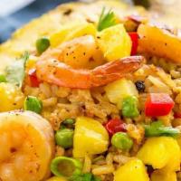 Pineapple Fried Rice · Your choice of meat stir-fried with Thai jasmine rice, egg, onion, green onion, tomatoes, pi...