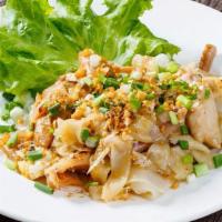 Chicken Noodles / Kua Kai · Large flat rice noodles stir-fried with chicken and green onion, served atop Thai lettuce an...