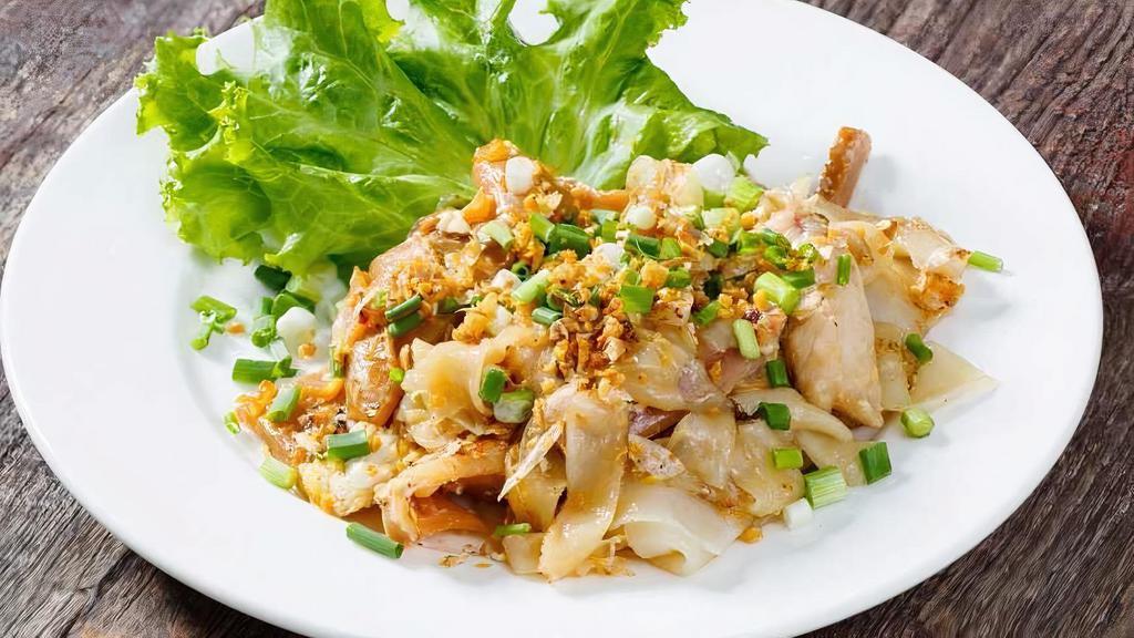Chicken Noodles / Kua Kai · Large flat rice noodles stir-fried with chicken and green onion, served atop Thai lettuce and comes with Thai chili sauce.