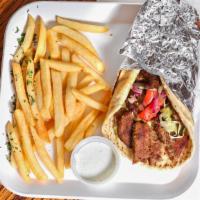 Gyros Pita · Lamb/Beef Gyros thinly sliced off vertical skewer! Served with onions, tomatoes, and taziki ...