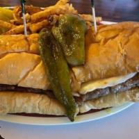 The Broadway Slopper · Open faced burger smothered in Red or Green Chili