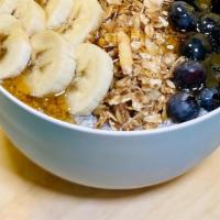 Overnight Chia Bowl (Gf) · Organic chia seeds soaked in coconut milk topped with blueberries, bananas, granola, and a h...