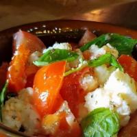Caprese · Chopped fresh mozzarella, tomatoes, sweet basil, salt and Balsamic Vinaigrette