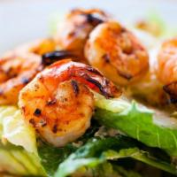 Scampi Insalata · Seasoned grilled shrimp on top of our fresh garden salad with lemon slices.