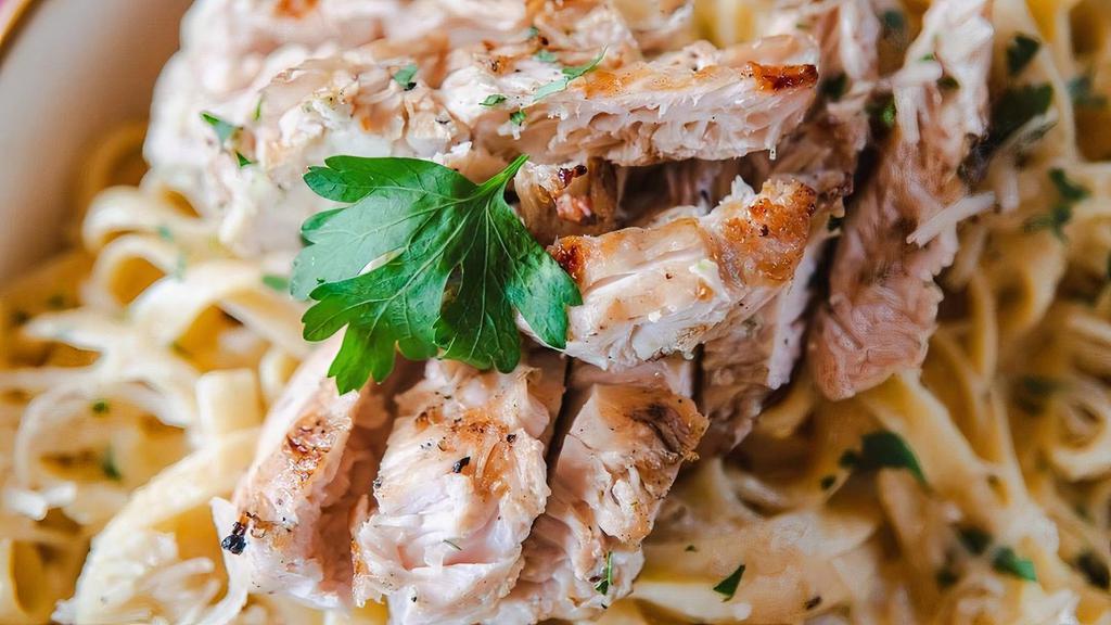 Fettuccine Con Pollo Or Scampi Alfredo · Creamy Alfredo sauce with seasoned grilled chicken or shrimp with parmesan cheese.