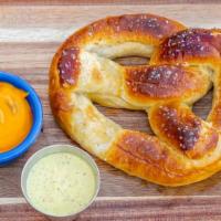 Pretzel · Served with a side of spicy queso sauce and mustard aioli.