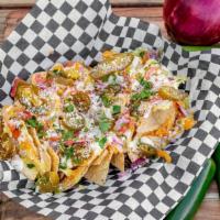  Chicken Nachos · Tortilla chips topped with grilled chicjken, cheddar Jack cheese blend, spicy queso sauce, M...