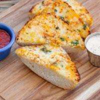 Cheesy Garlic Bread · Cheesy garlic bread strips served with a side of ranch dressing andmarinara sauce. Add spicy...