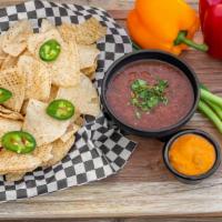 Chips And Salsa · Tortilla chips served with our house made salsa. Add spicy queso sauce for an additional cha...