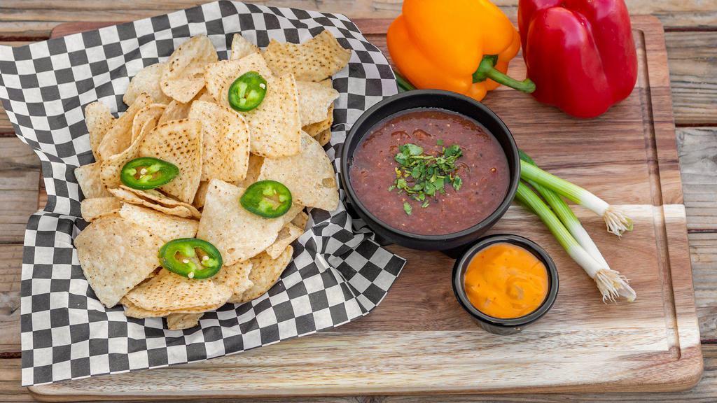 Chips And Salsa · Tortilla chips served with our house made salsa. Add spicy queso sauce for an additional charge.