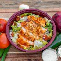 Buffalo Chicken Salad · Romaine lettuce topped with diced tomatoes, cheddar Jack cheese, cucumbers, red onions, and ...