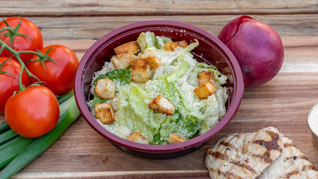 Caesar Salad · Romaine lettuce tossed with Caesar dressing, Parmesan cheese, and croutons. Add-ons for an additional charge.